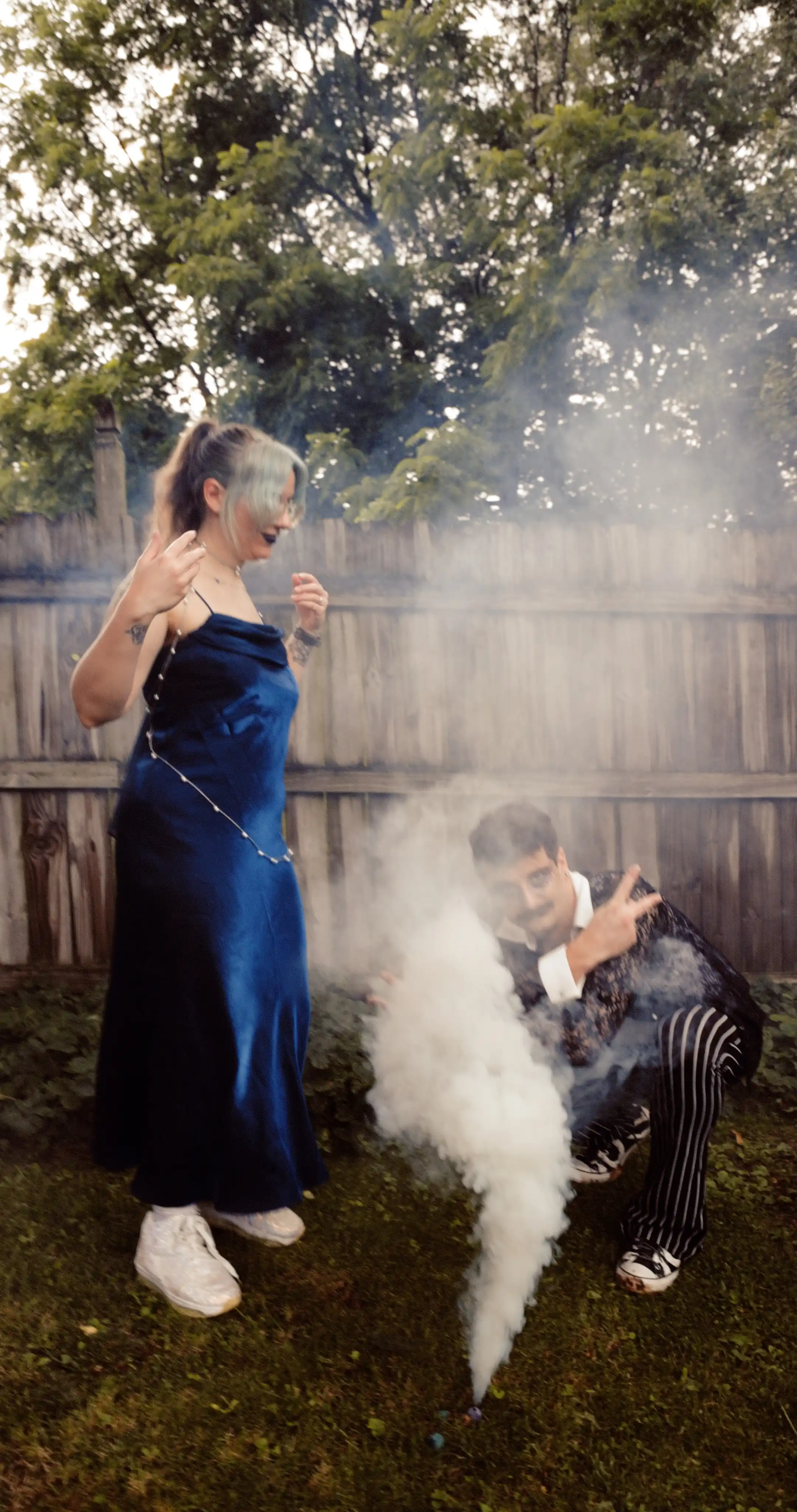 Bug on the left, dressed as the constellation Aries. Moss on the right dressed as a celestial gameshow host.