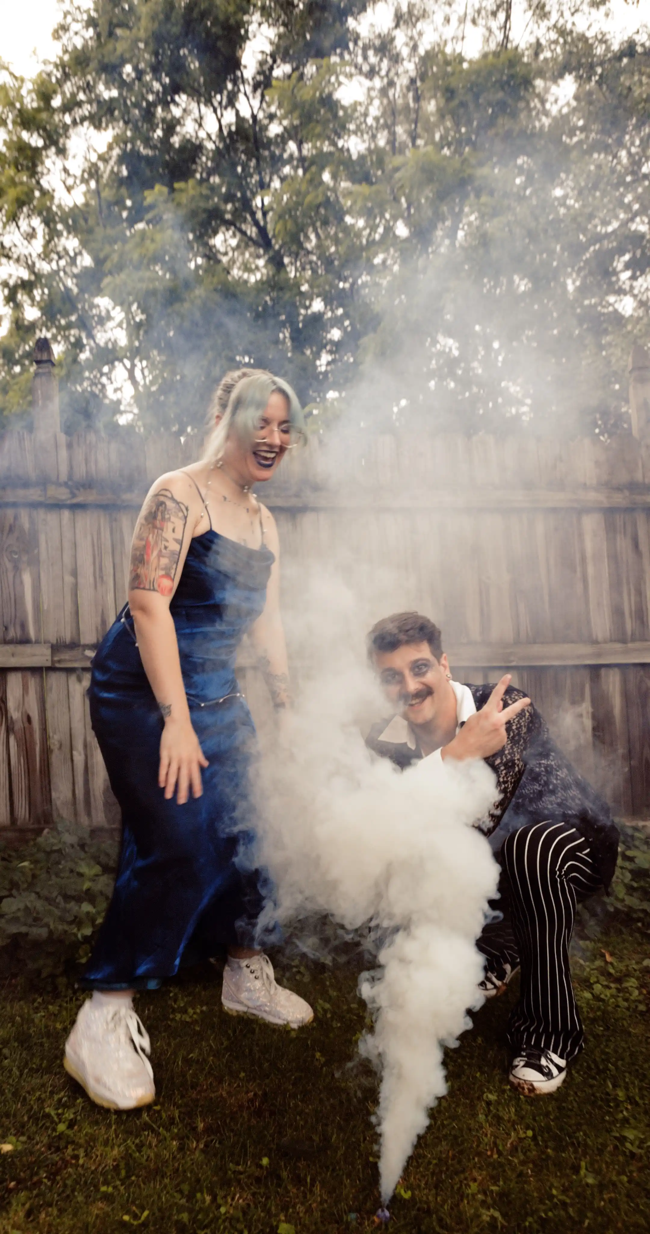 Bug on the left, dressed as the constellation Aries. Moss on the right dressed as a celestial gameshow host.